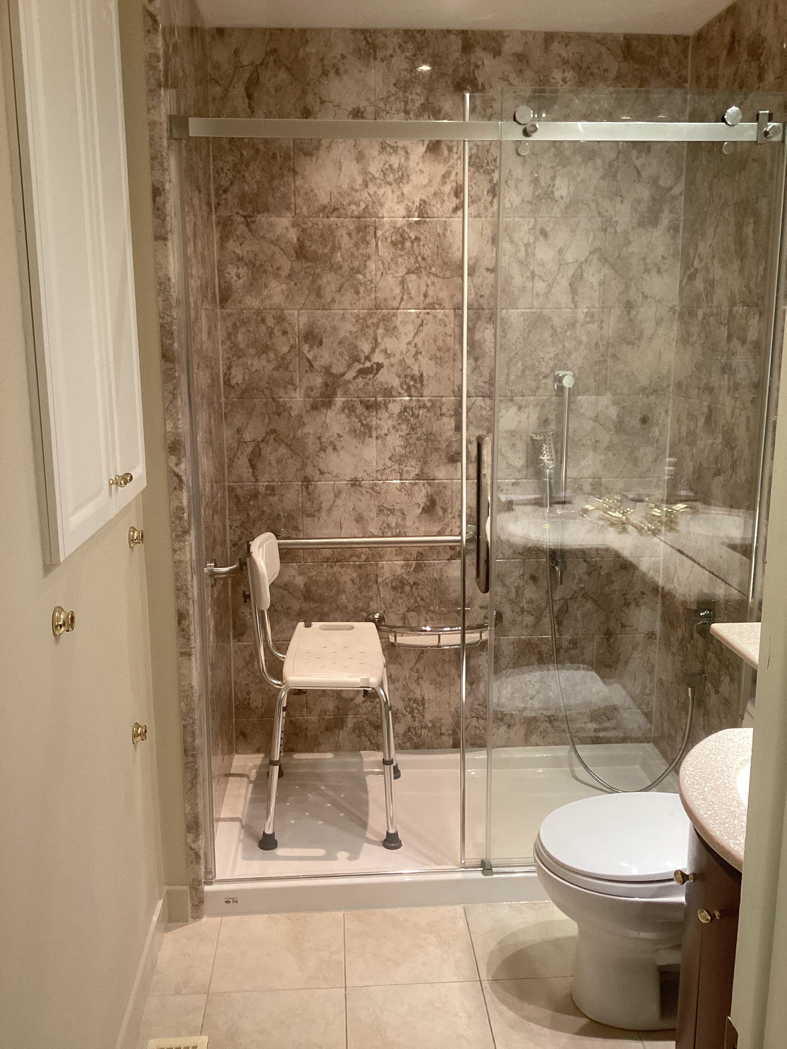 Accessible bathroom with shower chair.