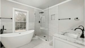 Modern bathroom shower renovation with walk-in glass enclosure in Ottawa