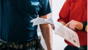 Contractor reviewing shower or tub renovation plans with Ottawa homeowner
