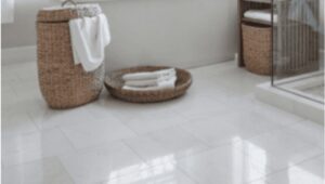 Modern bathroom flooring with light tile and wicker basket accent in Ottawa home